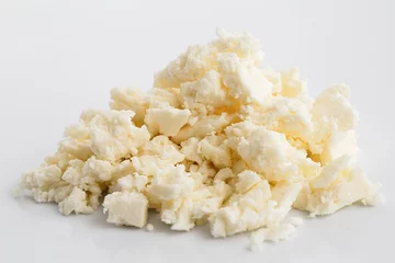  Crumbled white feta cheese isolated on white. © Moving Moment