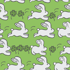 Seamless Vector Pattern with Rabbits  and Clover on a Green Background