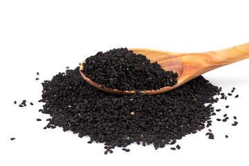 Heap of black sesame on wooden spoon