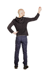 smiling young man with bald head writing something with a marker