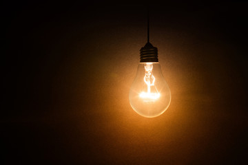 light bulb on dark background - Powered by Adobe