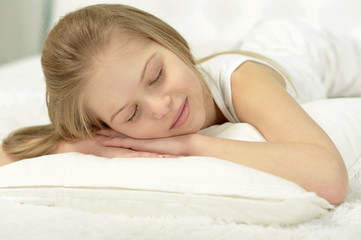 Little girl sleeping with  toy