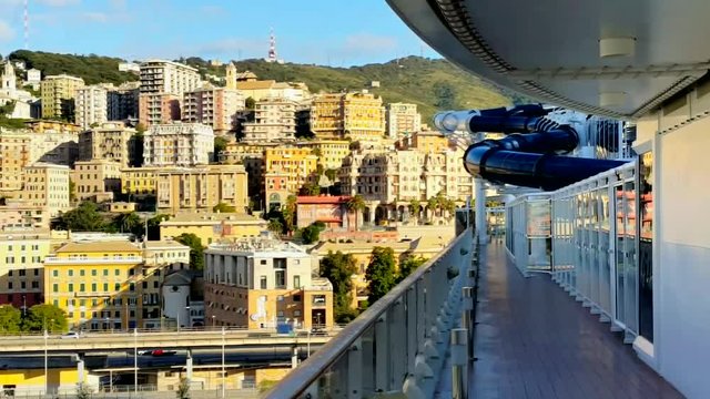 View of The Terraced Urban Genoa From The Deck of a Cruise Ship. Above Deck, Visible Part of The Pipe Water Attractions.