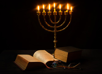Old candelabra, prayer-book and glasses - obrazy, fototapety, plakaty