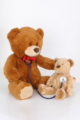 Doctor teddy heal a sick child and comforts