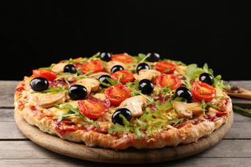 Delicious tasty pizza on black background