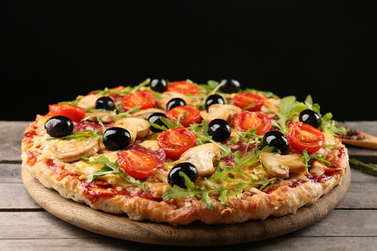 Delicious Tasty Pizza On Black Background