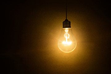 light bulb on dark background - Powered by Adobe