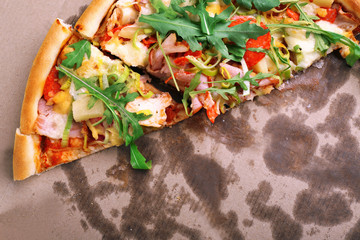Naklejka na ściany i meble Sliced fresh pizza on cardboard background