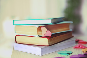 Heart bookmark for book on wooden table closeup