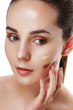 Beauty Girl Try to Different tones of Foundation Concealer. Natural Makeup for Brunette Woman with  Beautiful Face. Makeover. Perfect Skin. Applying Make-up. Ideal for commercial 