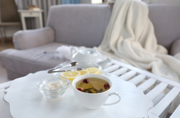 Tea set on a white wooden tray