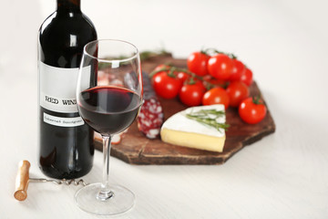 Glass of wine with food on table closeup