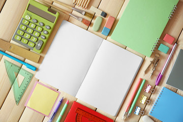 Flat lay of stationery on wooden background, copy space
