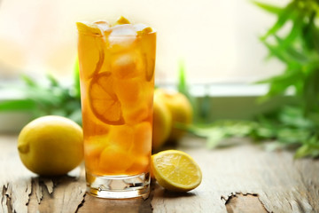 Glass of iced tea with lemon on a windowsill