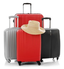 Suitcases with hat isolated on white
