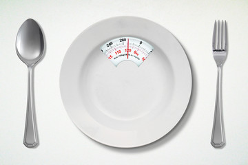 Empty dish with stainless spoon and fork