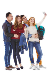 Obraz premium Young people taking selfie with mobile phone isolated on white