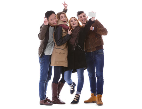 Young People Taking Selfie In Their Winter Clothes Isolated On White