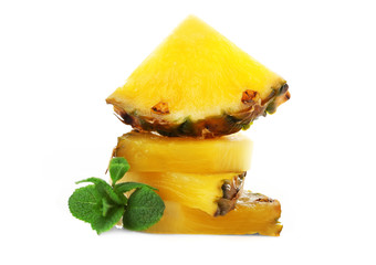 Stack of juicy pineapple slices with fresh mint, isolated on white