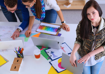 Portrait of attractive female  designer in office