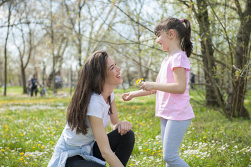 Mother with her daughter in the park