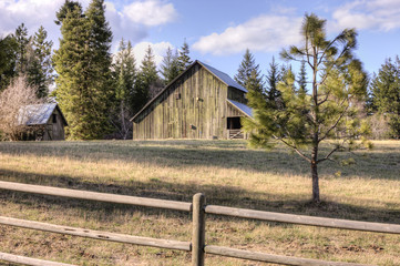 Rustic old barn on clear day.
