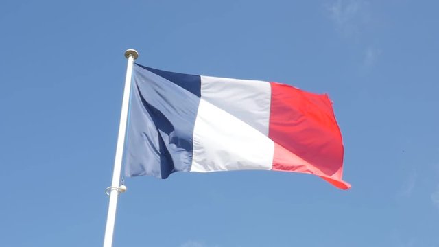 Slow motion of French flag fabric waving in front of blue sky 1920X1080 FullHD footage - Tricolor flag of France slow-mo flowing by the day 1080p HD video 