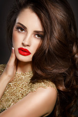 Beauty woman red lips long curly hair brunette