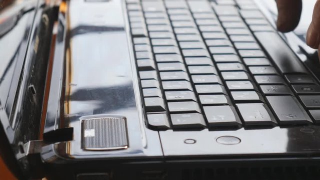 Man typing on laptop computer
