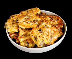 Chicken cutlets on black background