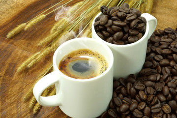coffee and roasted coffee beans on wooden