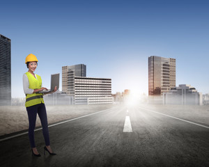 Asian woman in safety vest posing