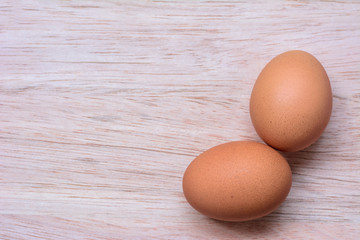Fresh eggs on wooden background
