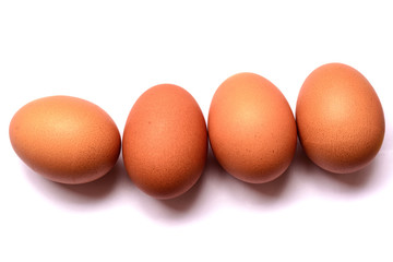 Fresh eggs on white background