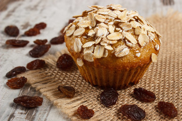 Fresh muffin with oatmeal baked with wholemeal flour and raisins, delicious healthy dessert