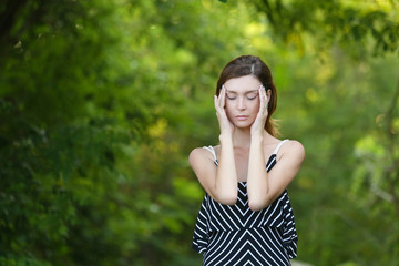 Fototapeta premium Caucasian girl relaxing and enjoying life in forest's fresh air