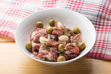 Marinade of lamb stew with herbes de Provence, garlic and olives