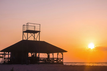 Dawn meets a house by the sea