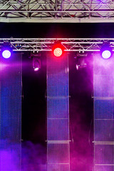 outdoor stage with spotlight and screens