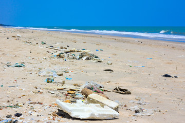 Fototapeta na wymiar Pollution on the beach of tropical sea. Outdoors.