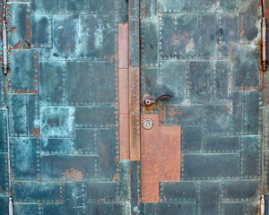 vintage rusty door closeup, metal background