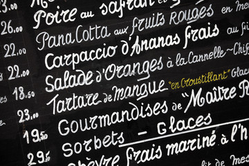 Restaurant french chalk menu board in Paris France closeup photo