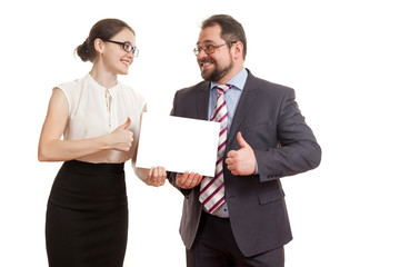 the woman and the man hold a sheet of paper