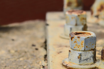 Big rusty metal nuts locked