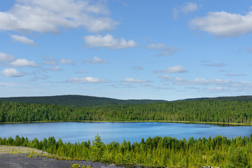 Fototapeta premium Northern landscape with blue lake. Finnish Lapland