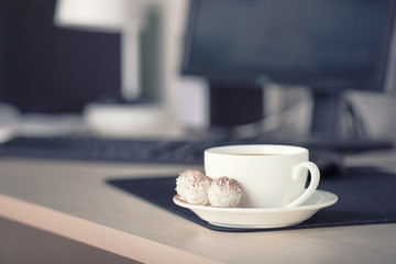 Cup with coffee on the workplace. Bussines concept and idea