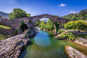 Old Roman stone bridge in Cangas de Onis (Asturias), Spain - 107044180