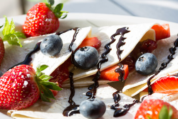Crepes with strawberries and blueberries