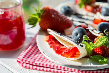 Crepes with strawberries and blueberries